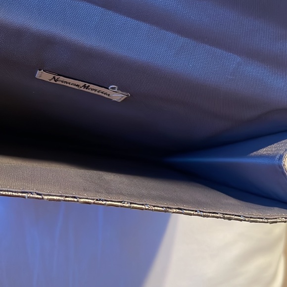 Neiman Marcus wristlet. Silver. Shine pulls bronze or gray depending. 9.5”x5.5” - Picture 4 of 8